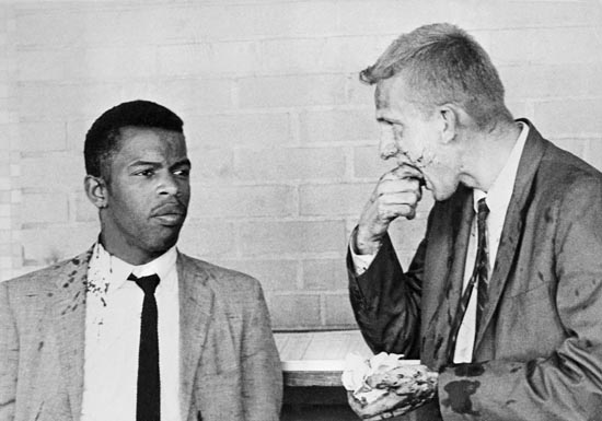 20 May 1961, Montgomery, Alabama, USA --- Two blood-splattered Freedom Riders, John Lewis (left) and James Zwerg (right) stand together after being attacked and beaten by pro-segregationists in Montgomery, Alabama. --- Image by © Bettmann/CORBIS