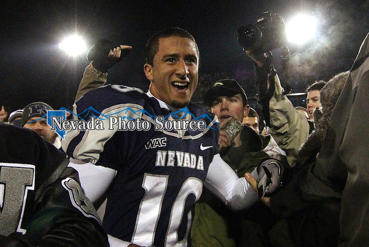 Nevada Wolf Pack quarterback Colin Kaepernick celebrates with fans as he leaves the field after a 34-31overtime win over Boise State during the NCAA college football game Friday night, Nov. 26, 2010, in Reno, Nev. (AP Photo/Cathleen Allison)