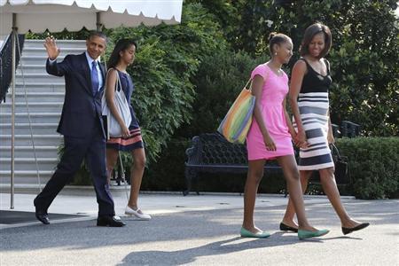 U.S. President Barack Obama (L) waves as he and his wife Michelle (R) and daughters Malia (2nd L) and Sasha (2nd R) depart for travel to Africa, from the South Lawn of the White House in Washington, June 26, 2013 file photo. REUTERS/Jonathan Ernst