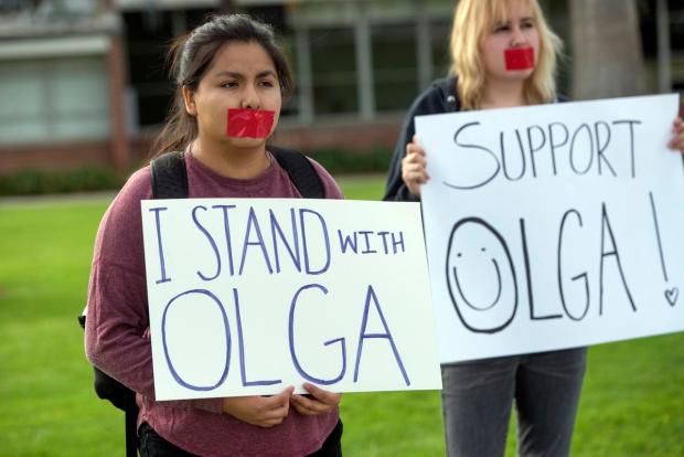 Orange Coast College students Jennifer Robles, a political Science major, and Kiki Ruiz, a psychology major, rally in support of instructor Olga Perez Stable Cox during a campus rally in Costa Mesa, California, December 12, 2016. A video clip of Cox telling her human sexuality class that electing Trump was an act of terrorism has gone viral. A student said the teacher asked all Trump supporters to stand up so she could, "Show the class who to watch out for" (Photo by Jeff Gritchen, Orange County Register/SCNG)